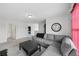 Upstairs living room featuring a gray sectional sofa, carpeted floors and neutral colors at 16440 Centipede St, Clermont, FL 34714