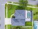 Aerial view of a home with a screened-in pool, well-maintained lawn, and a two-car driveway at 201 Hammock Dunes Pl, Orlando, FL 32828