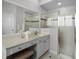 Bright bathroom with a glass-enclosed shower, vanity, and modern fixtures at 201 Hammock Dunes Pl, Orlando, FL 32828