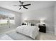Well-lit bedroom showcasing a comfortable bed, ceiling fan, and ample space at 201 Hammock Dunes Pl, Orlando, FL 32828