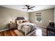 Modern bedroom featuring wood floors, side tables, and a queen bed offering a restful retreat at 201 Hammock Dunes Pl, Orlando, FL 32828