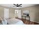 Bedroom featuring hardwood floors, a glass table, and a queen size bed offering a warm and inviting atmosphere at 201 Hammock Dunes Pl, Orlando, FL 32828