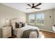 Bedroom featuring two windows, creating a serene space complemented by side tables, and a comfortable bed at 201 Hammock Dunes Pl, Orlando, FL 32828