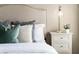 Comfortable bedroom with tufted headboard, plush pillows, and side table with modern lighting for a cozy feel at 201 Hammock Dunes Pl, Orlando, FL 32828