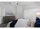 Bright bedroom with white walls, modern decor, dresser, and closet, creating a cozy, inviting space at 201 Hammock Dunes Pl, Orlando, FL 32828