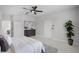 Bright bedroom with a dresser, ensuite bathroom, and hardwood floors at 201 Hammock Dunes Pl, Orlando, FL 32828