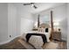Comfortable bedroom featuring a double bed, ceiling fan, and wood-look flooring at 201 Hammock Dunes Pl, Orlando, FL 32828