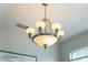 Close up of modern chandelier in dining room at 201 Hammock Dunes Pl, Orlando, FL 32828