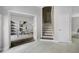 Bright foyer featuring an adjacent home office and staircase at 201 Hammock Dunes Pl, Orlando, FL 32828