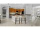 Open kitchen boasts granite counters, bar seating and a view to the living room and breakfast nook at 201 Hammock Dunes Pl, Orlando, FL 32828