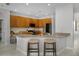 Eat-in kitchen with granite counters, stainless steel appliances, and a breakfast bar with seating at 201 Hammock Dunes Pl, Orlando, FL 32828