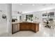 Open concept kitchen featuring stainless appliances and a seamless flow to the dining area and living spaces at 201 Hammock Dunes Pl, Orlando, FL 32828