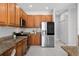 Well-equipped kitchen with stainless steel appliances and lots of counter space and storage at 201 Hammock Dunes Pl, Orlando, FL 32828