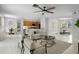 Open-concept living room with kitchen and dining views offers spacious living at 201 Hammock Dunes Pl, Orlando, FL 32828