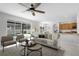 Open concept living room flowing into the kitchen and dining area at 201 Hammock Dunes Pl, Orlando, FL 32828