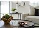 Living room detail with coffee table decor and a comfortable seating area at 201 Hammock Dunes Pl, Orlando, FL 32828