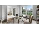 Bright office space with large windows, stylish desk, view to entry, and neutral decor at 201 Hammock Dunes Pl, Orlando, FL 32828