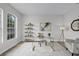 Bright office featuring a large window, stylish desk, and comfortable seating area at 201 Hammock Dunes Pl, Orlando, FL 32828