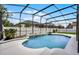 This screened-in pool has a water feature and a lush green yard beyond the fence at 201 Hammock Dunes Pl, Orlando, FL 32828