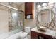 Modern bathroom with decorative tile, glass shower door, granite counters, and vessel sink at 2017 W Gore St, Orlando, FL 32805