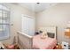 Comfortable bedroom with a ceiling fan, closet, and natural light from the window at 2017 W Gore St, Orlando, FL 32805