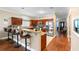 Kitchen featuring granite countertops, stainless appliances, breakfast bar and wood cabinets at 2017 W Gore St, Orlando, FL 32805