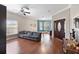 Spacious living room boasts hardwood floors, neutral paint, bay window, and grand front door at 2017 W Gore St, Orlando, FL 32805
