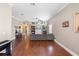 Open-concept living room with hardwood floors, comfortable seating, and ample natural light at 2017 W Gore St, Orlando, FL 32805