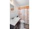 The bathroom features tile flooring, a vanity and a shower tub combo at 2044 W Gore St, Orlando, FL 32805