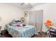 The bedroom features hardwood floors, natural light and functional design at 2044 W Gore St, Orlando, FL 32805