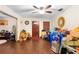 The bright living room features hardwood floors, a wood front door, and abundant natural light at 2044 W Gore St, Orlando, FL 32805
