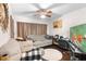A comfortable living room featuring hardwood floors, decorative mirror and plenty of seating at 2044 W Gore St, Orlando, FL 32805