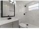 Bathroom features a modern vanity, contemporary fixtures, and updated shower with rainfall showerhead at 2050 Anne Cir, South Daytona, FL 32119