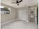 Bedroom features modern fan, marble floors, large closet, and bright natural light at 2050 Anne Cir, South Daytona, FL 32119