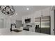 Well-equipped kitchen with modern appliances, white cabinetry, and a sleek stainless steel refrigerator at 2050 Anne Cir, South Daytona, FL 32119