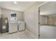 Laundry room features a new washer/dryer, water heater, and access to the garage at 2050 Anne Cir, South Daytona, FL 32119