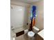 Bathroom featuring a combination bathtub and shower with tiled walls and toilet at 223 Palermo St, Davenport, FL 33897