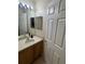 Bathroom featuring a single vanity with a mirror, with tile flooring at 223 Palermo St, Davenport, FL 33897