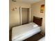 Cozy bedroom featuring a twin bed and a closet at 223 Palermo St, Davenport, FL 33897