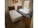 Bright bedroom featuring two twin beds and neutral decor at 223 Palermo St, Davenport, FL 33897