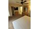 Comfortable bedroom with ceiling fan, ensuite, and large dresser at 223 Palermo St, Davenport, FL 33897