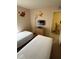 Bright bedroom featuring two twin beds, wall decor, and closet at 223 Palermo St, Davenport, FL 33897