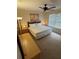 Comfortable main bedroom with a large window, ceiling fan, and neutral decor at 223 Palermo St, Davenport, FL 33897