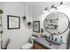 Charming bathroom with shiplap walls, modern fixtures, stylish vanity, and decorative accents at 225 Temple Cir, Eustis, FL 32726
