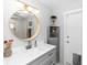 Bright bathroom with marble counters, modern lighting, and decorative accents at 225 Temple Cir, Eustis, FL 32726