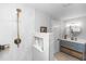 Modern bathroom featuring a shower, vanity and gray cabinets at 225 Temple Cir, Eustis, FL 32726