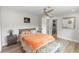Cozy bedroom with hardwood floors, bench, and natural light at 225 Temple Cir, Eustis, FL 32726