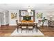 Elegant dining area featuring stylish decor, hardwood flooring, and a cozy, inviting atmosphere at 225 Temple Cir, Eustis, FL 32726