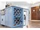 Close-up of a kitchen island with wine storage, complemented by a hardwood floor and the entrance at 225 Temple Cir, Eustis, FL 32726