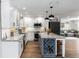 Open-concept kitchen with stylish island, state-of-the-art appliances, and ample countertop space at 225 Temple Cir, Eustis, FL 32726